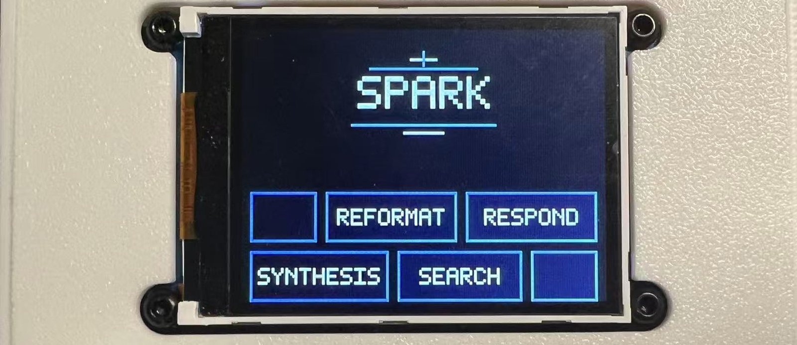 SPARK prototype in a white enclosure with local AI action controls